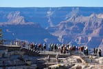 Tourists flock to Mather Point at Grand Canyon National Park, Oct. 1, 2025, in Grand Canyon, Ariz.