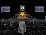 A portrait of Japan's former prime minister Shinzo Abe hangs above the stage during his state funeral in the Nippon Budokan Hall in Tokyo on Tuesday.