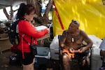 Joseph Ah Puk, a third generation Lahainan, talks with Dr. Niheu at the boat ramp. Ah Puk has two nieces and a brother that lost their homes in the fire. It missed his house by two blocks.