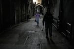People walk past closed shops at the nearly empty traditional main bazaar during Iranian New Year, or Nowruz, holidays in Tehran, Iran, March 29, 2026.