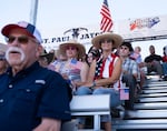 A crowd watches the steer wrestling event at the St. Paul Rodeo. The St. Paul Rodeo, a staple since 1936, draws thousands to the small community each year for its various sporting events and fair grounds.
