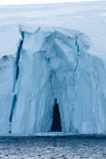 An ice cave seen carved out in an iceberg.