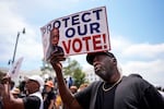 Aaron McGuire sings a spirtual song during a voting rally, Saturday, May 16, 2026, in Montgomery, Ala.