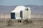 Two deer are pictured near the D Reactor on the Hanford site. 