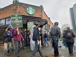 Starbucks baristas on strike Thursday, Nov. 13, 2025, at the University Avenue location in Seattle.