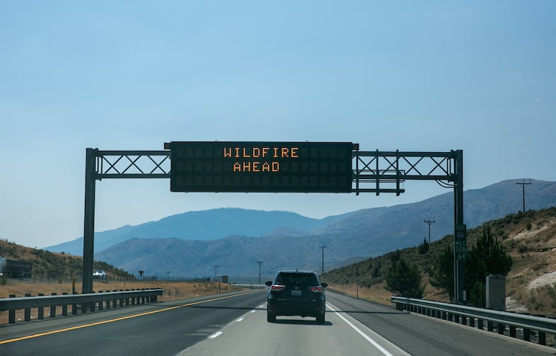 A sign warns of wildfire ahead on I-84 east near Durkee, Ore., July 31, 2024. The Durkee fire burned nearly 295,000 acres over the course of two weeks. 