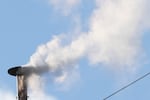 White smoke billows from the chimney of the Sistine Chapel during the conclave to elect a new pope, at the Vatican, Thursday, May 8, 2025.