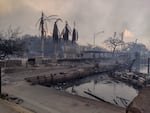 August 10: A charred boat lies in the scorched waterfront after wildfires fanned by the winds of a distant hurricane devastated Maui's city of Lahaina, Hawaii.