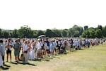 Spectators wait in the queue on day one of The Championships Wimbledon 2025 at All England Lawn Tennis and Croquet Club, June 30.