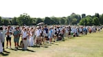 Spectators wait in the queue on day one of The Championships Wimbledon 2025 at All England Lawn Tennis and Croquet Club, June 30.