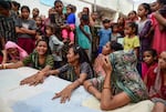 Relatives and neighbors of Akash Patni, a 14-year-old tea vendor who died in Air India Boeing 787 Crash, mourn as they wait for the dead body at his residence, on June 15, 2025 in Ahmedabad, India. The Boeing 787 Dreamliner crashed shortly after takeoff, killing 241 of the 242 people on board. The plane crashed on June 12, 2025, after the pilot issued a mayday call to air traffic control.