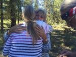Jeanette Finicum hugs a supporter after a Father's Day celebration at the site of her husband's death along U.S. Route 395.