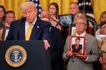 Greg Swan, whose son Drew died as a result of a fentanyl-related substance, looks on as U.S. President Donald Trump speaks in the East Room of the White House. The president signed the HALT Fentanyl Act, which aims to permanently classify all fentanyl-related substances as schedule I controlled substances and aid law enforcement in prosecuting trafficking and manufacturing offenses.