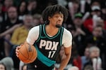 FILE - Portland Trail Blazers guard Shaedon Sharpe dribbles during the second half of an NBA basketball game against the Sacramento Kings, Sunday, April 12, 2026, in Portland, Ore.