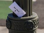 An envelope labeled "Rent Money" is left tucked in a lighting pole in Los Angeles on April 1. President Trump's new executive order to prevent evictions isn't enough and Congress needs to act, housing activists say.