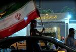 An Iraqi protestor carrying Iranian flag in front of the Iranian embassy in celebration of a ceasefire between Iran and Israel, in Baghdad, Iraq, Tuesday, June 24, 2025. (AP Photo/Hadi Mizban)