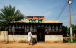 A Sudanese man walks out of a bakery in Darfur's state capital Niyala on October 11, 2019.