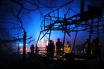 Rescuers work at a market destroyed by a Russian airstrike on Zaporizhzhia, Ukraine, on Friday.