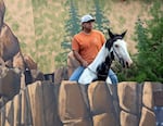 Happy Canyon Night Show cast member Aaron Hines and his horse Dancer during a rehearsal. They will fulfill several roles representing Happy Canyon in various parades and carry the flag during the national anthem.