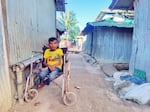 A Rohingya man in his wheelchair,. "We think that photography and storytelling have that power to motivate people and to draw their attention to our crisis," says photographer Mohammed Salim Khan.