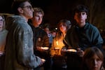 Mourners attend a vigil Friday, Oct. 16, 2026, in downtown Bend, Ore.