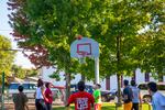 Young men, many of whom grew up together, play basketball in Madras, Ore., on Sept. 1, 2020. For some, basketball is a vital escape from work-life stress. 