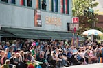 One week after mourners gathered in front of popular Portland gay club The Embers Avenue for a vigil to honor those killed in a mass shooting at an Orlando gay nightclub, tens of thousands of people lined the streets for the city's annual Pride Parade.