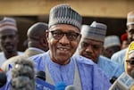 Nigeria's President Muhammadu Buhari speaks to the media after casting his vote in his hometown of Daura, in northern Nigeria, Saturday, Feb. 23, 2019.
