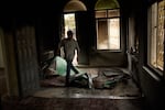 A Palestinian man walks in a mosque that was burned during an attack by Israeli settlers in the West Bank village of Mikhmas, east of Ramallah, Wednesday, Oct. 14, 2026.