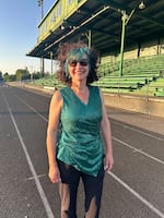 Band Director Tawnya Garcia poses after a "One More Time Around Again Marching Band" performance at Parkrose High School.