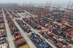 Shipping containers are seen ready for transport at the Guangzhou Port in the Nansha district in southern China's Guangdong province in April 2025.