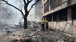 Firefighters work at the site of an airplane that crashed in India's northwestern city of Ahmedabad in Gujarat state