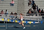 A student from another school runs in a track and field meet at Jefferson High School.