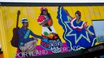 A mural representing Latino culture adorns the exterior wall above the main entrance to the Portland Mercado in SE Portland, Ore., on Wednesday, May 20, 2020. The Portland Mercado, opened in 2015, serves as an incubator for Latino-owned and operated small businesses, especially restaurants and food carts.