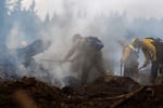 FILE - Wildland firefighting trainees work to put out a controlled burn during the annual five-day Mid-Willamette Valley Interagency Wildland Fire School, hosted by the Oregon Department of Forestry, in Sweet Home, Ore., on June 26, 2026.