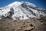 Hikers stand along Burroughs Mountain Trail with a view of Mount Rainier on Saturday, July 20, 2019.