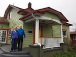Judy Welles and Duane Fickeisin with their very energy efficient home in Southeast Portland.