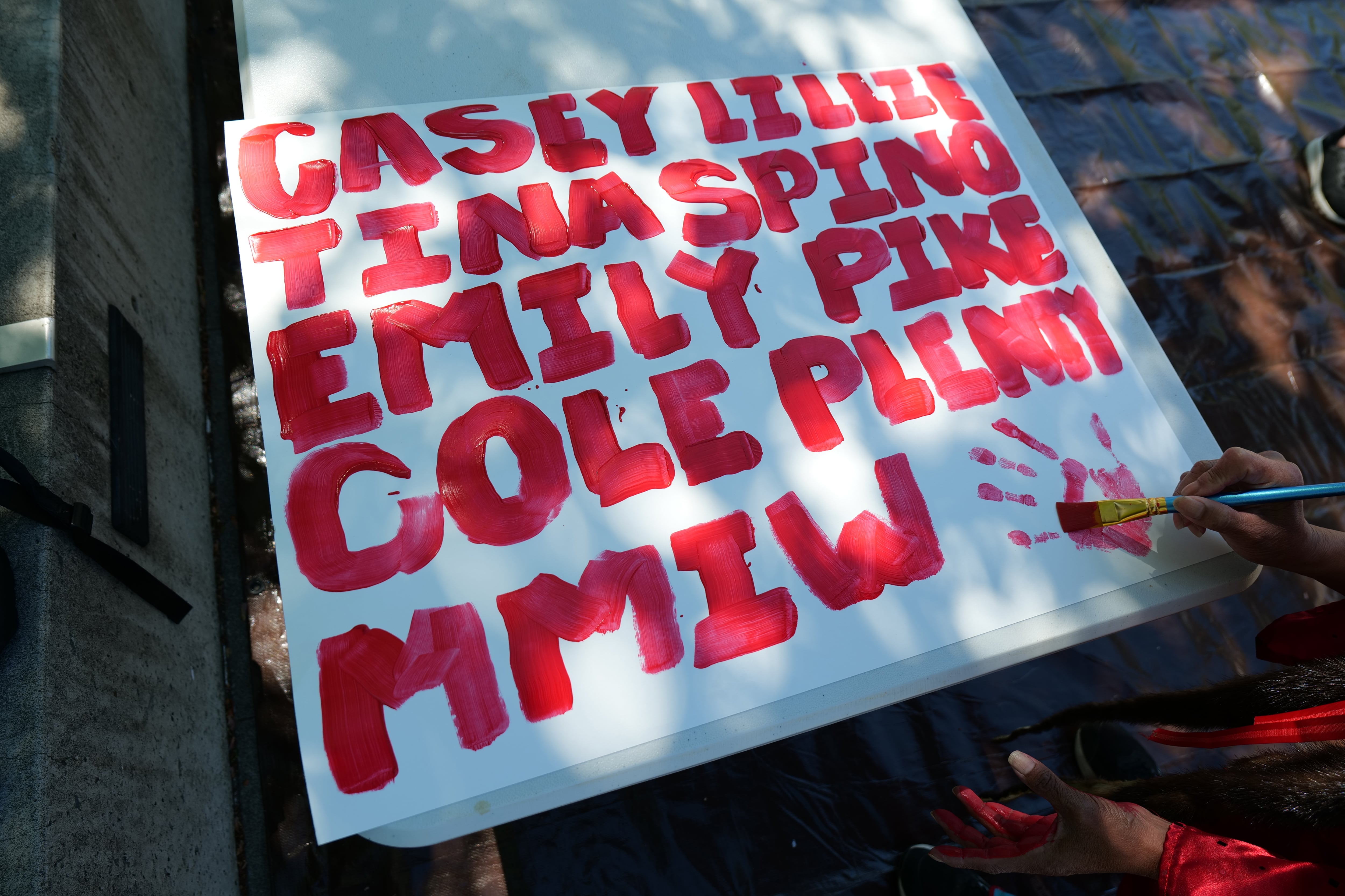 Names of victims were painted on poster paper during the sign making portion of the MMIR Day Of Awareness and Action.