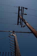 Security cameras are mounted outside Abimael Dominguez’s junkyard business in Montebello, California. June 19, 2025. Zaydee Sanchez for NPR