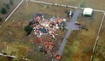 This image taken from video provided by KOCO shows damage caused by a tornado in a neighborhood near 89th and S. Sooner Road in North Moore, Okla., Sunday, Nov. 3, 2024.