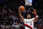 Portland Trail Blazers guard Scoot Henderson lays the ball up against the Phoenix Suns during the Blazers season opening game at the Moda Center in Portland, Ore., on Oct. 21, 2026.