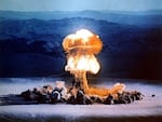 A mushroom cloud rises from a test blast at the Nevada Test Site on June 24, 1957.
