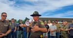 In this screenshot from a YouTube video, Lewis County Sheriff Robert Snaza tells a crowd "Don't be a sheep" when it comes to following Gov. Jay Inslee's face covering order.