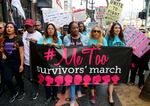 In this 2017, file photo, Tarana Burke (center), founder and leader of the #MeToo movement, marches with others at the #MeToo March in the Hollywood section of Los Angeles.