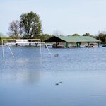 The melt of California's massive snowpack has led to chronic flooding in the Central Valley this spring, like this riverfront park near the town of Grayson.