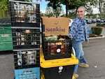 Urban Gleaners community support associate Zia Laboff pulling a cart of gleaned foods from New Seasons Market in Beaverton, Ore. on Sept. 21, 2025. Urban Gleaners rescues fresh food destined for the dump and redistributes it to people in need.