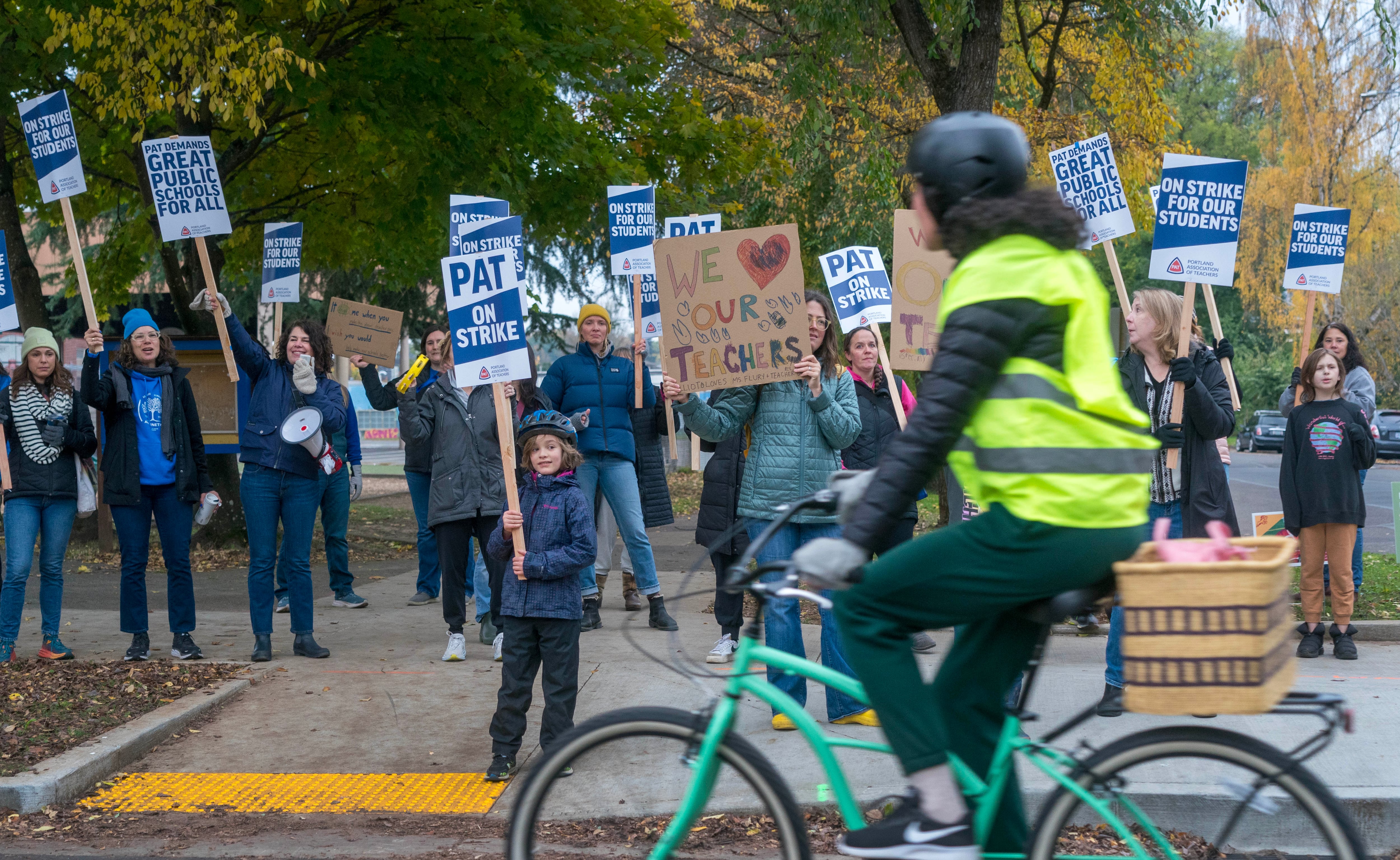 Teachers, parents and a few students protest outside of Abernethy Elementary School on the first day of the Portland Public Schools strike in Portland, Ore., Nov. 1, 2023. Strikes like this one put the topic of state school funding back in the spotlight, leading to the proposal of this new education bill in 2025.
