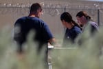 Incarcerated men at Snake River Correctional Institution in Ontario, Ore., work during a community event Aug. 25, 2019.