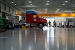 Employees walk through the facility.
