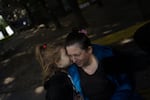 Natalia Kuzmina and her daughter Sofiia in Kharkiv. "I came back to Kharkiv for my children," she says. "It's important that children stay at home."